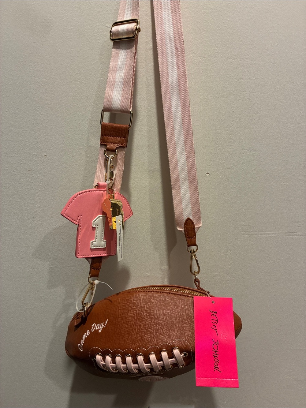 Betsey Johnson Brown Football Crossbody Bag with Pink Strap